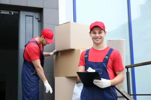 Vans and crew preparing reusable boxes for a sustainable move in Hillingdon