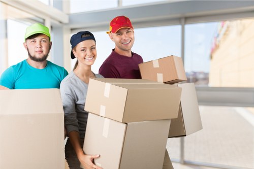 Professional packers carefully wrapping items for a move