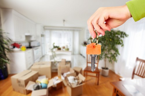Trained removal staff handling furniture carefully