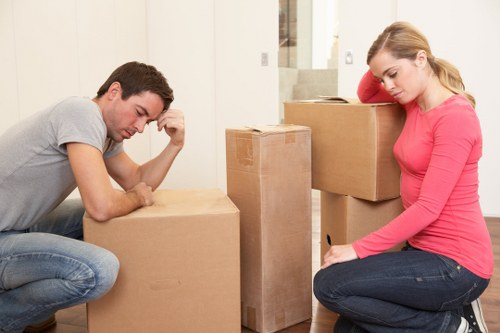 Professional movers loading furniture into a moving truck